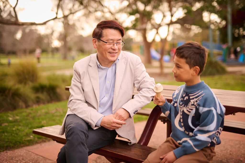 A Chinese man and child at the park
