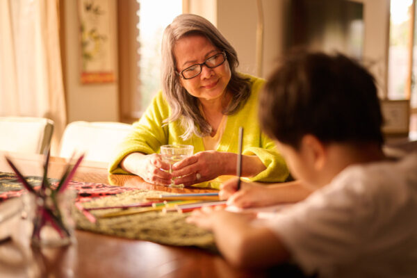 A Vietnamese woman and child sitting at a table